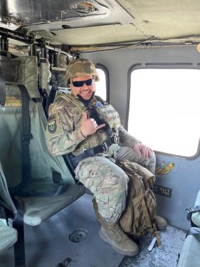 Robert W. Freeman in a UH-60 Blackhawk helicopter