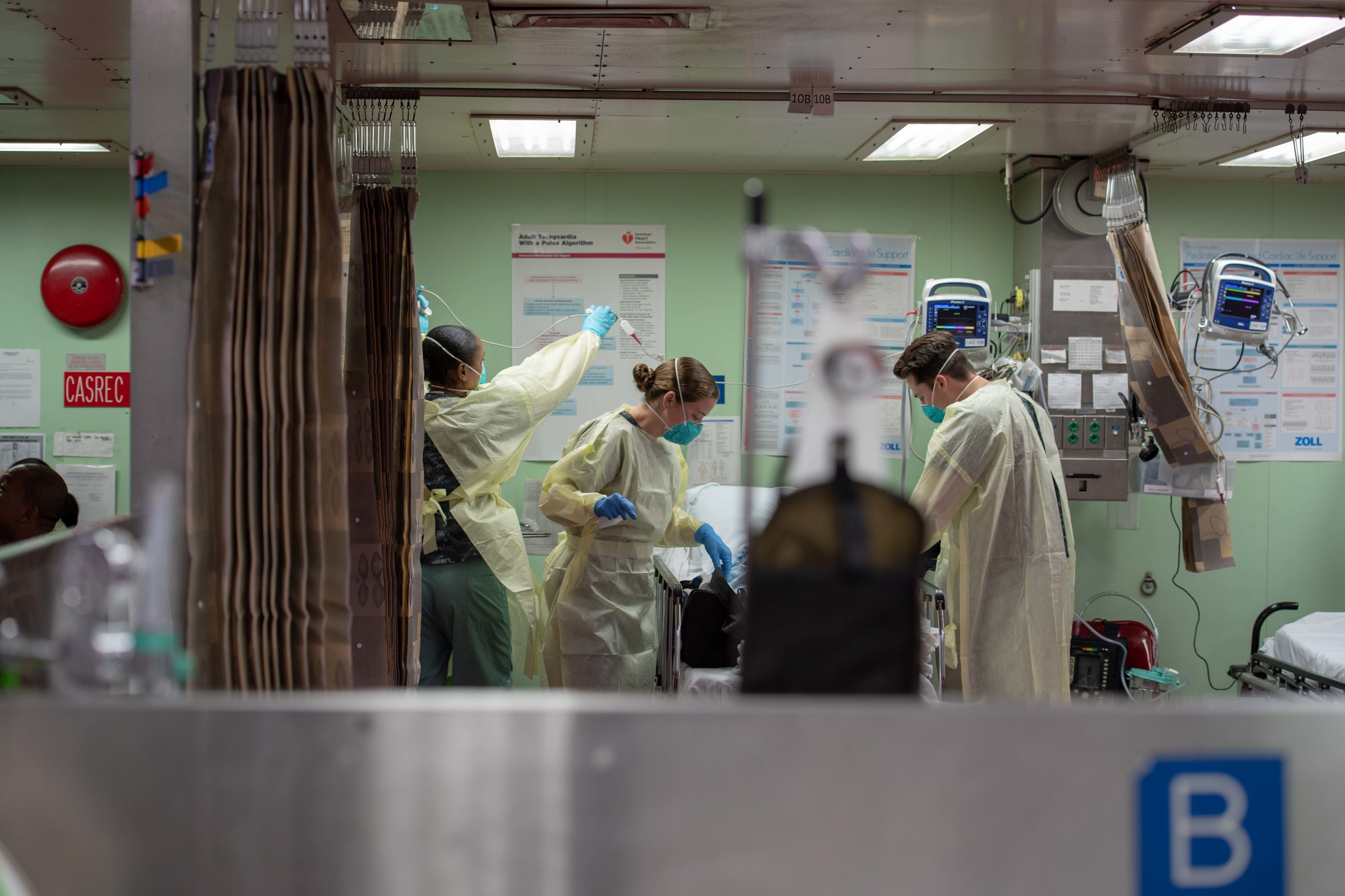 Sailors assigned to the hospital ship USNS Mercy (T-AH 19) admit a patient from a local hospital March 29
