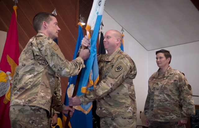 DISA Director hands change of command flag to Col. Skinner