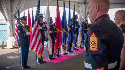Image of Air Force Lt. Gen. Robert J. Skinner, Defense Information Systems Agency director and Joint Force Headquarters-Department of Defense Information Network commander, Marine Corps Col. Matthew R. Simmons, outgoing DISA Pacific Command commander, and Marine Corps Col. Jared C. Voneida, incoming DISA Pacific Command commander, stand at attention as the change of command ceremony begins on July 15 aboard USS Missouri at Ford Island, Hawaii. Photo by Parish M. Kaleiwahea, DISA/Released.