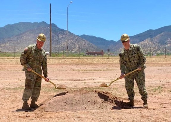 Army Col. Jarrod Moreland, Fort Huachuca garrison commander, left, and Navy Capt. Robert Matthias, commander, Joint Interoperability Test Command, Defense Information Systems Agency, right, pose for a photo during the groundbreaking for the Joint Interoperability Test Command’s future Test and Evaluation Facility, May 17, 2022, Fort Huachuca, Arizona. The more than $35 million military construction project will begin June 2022. (DOD photo by the Defense Information Systems Agency, Office of Strategic Communication and Public Affairs)