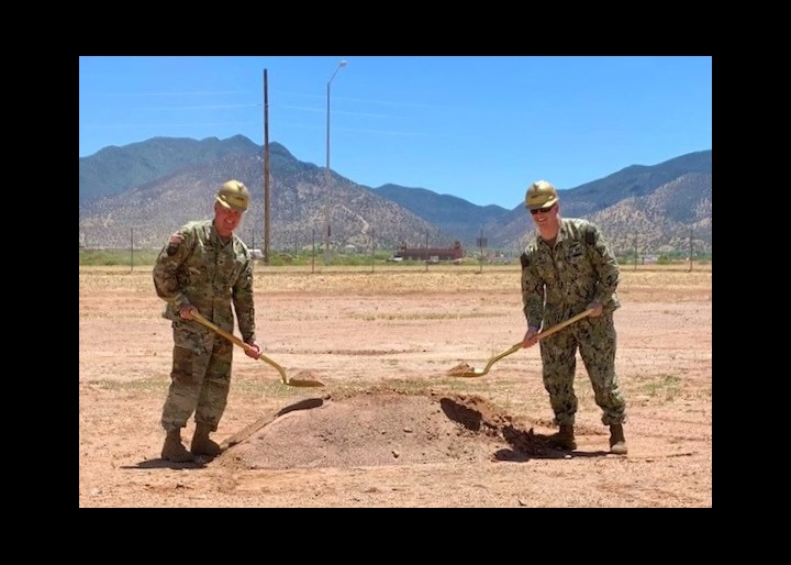 Army Col. Jarrod Moreland, Fort Huachuca garrison commander, left, and Navy Capt. Robert Matthias, commander, Joint Interoperability Test Command, Defense Information Systems Agency, right, pose for a photo during the groundbreaking for the Joint Interoperability Test Command’s future Test and Evaluation Facility, May 17, 2022, Fort Huachuca, Arizona. The more than $35 million military construction project will begin June 2022. (DOD photo by the Defense Information Systems Agency, Office of Strategic Communication and Public Affairs)