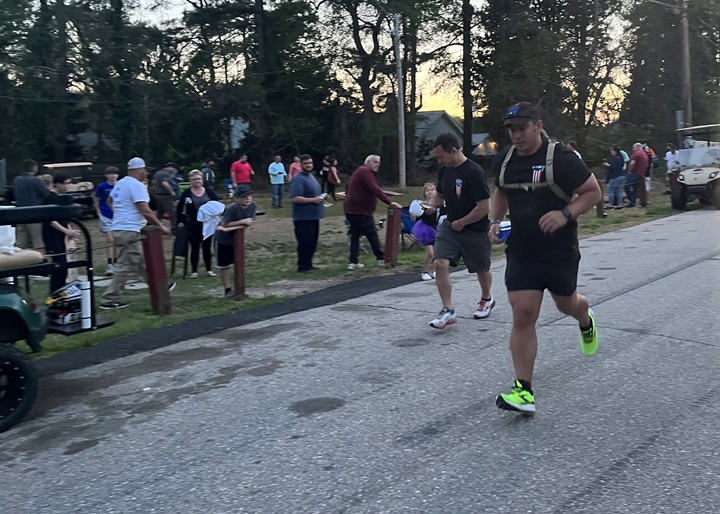 Neighbors, friends, co-workers and family support Kyle Butters during his 22 Miles to Break Boundaries event April 22-24 in Pasadena, Maryland.