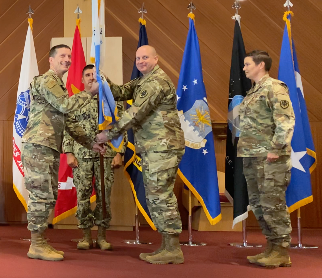 Lt. Gen. Skinner hands change of command flag to Col. Brent Skinner
