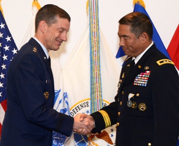 Air Force Lt. Gen. Robert J. Skinner, and Army Major Gen. Garrett Yee shake hands during Yee’s retirement ceremony